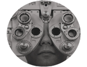 A close-up view of a person undergoing an eye exam using a phoropter, a diagnostic device for measuring refractive error and determining lens prescriptions.