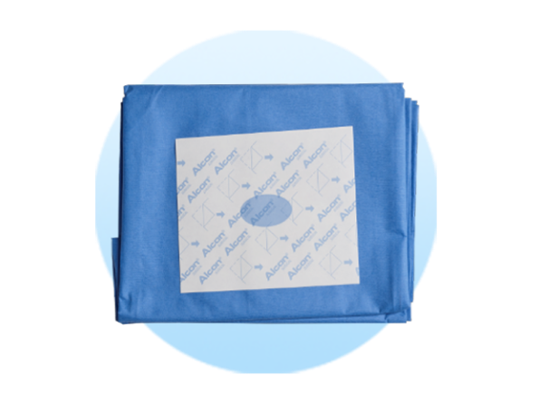 Folded surgical drapes on a pale blue circle background.