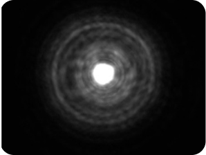 Zwarte achtergrond met een helder licht in het midden, met een halo rond het licht die groter is dan de AcrySof® IQ Monofocale en AcrySof IQ Vivity® IOLs, wat de halometing van de optical bank weergeeft voor de TECNIS Symfony Diffractive EDOF IOL.