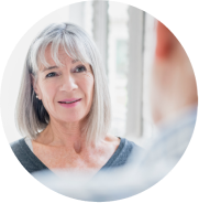 Older woman with white hair experiencing dry eye