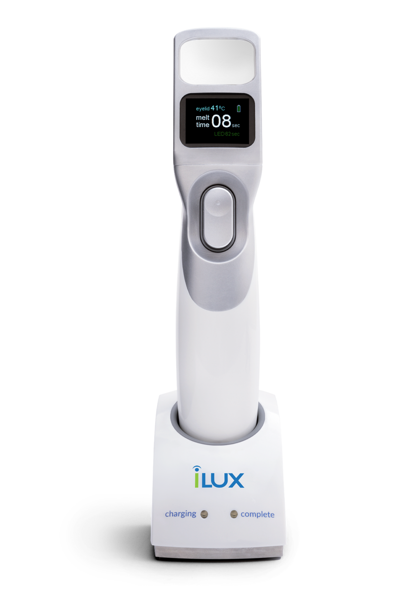 Systane iLux device sitting on the charging station