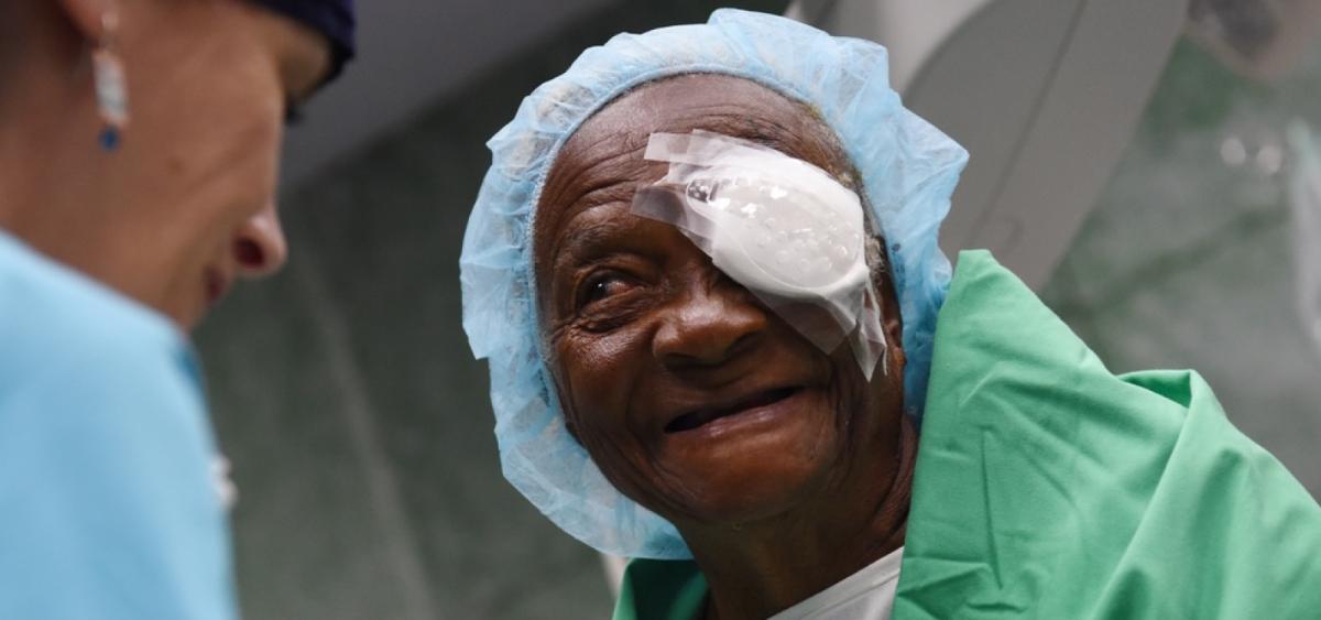 Older female patient with bandage over on eye