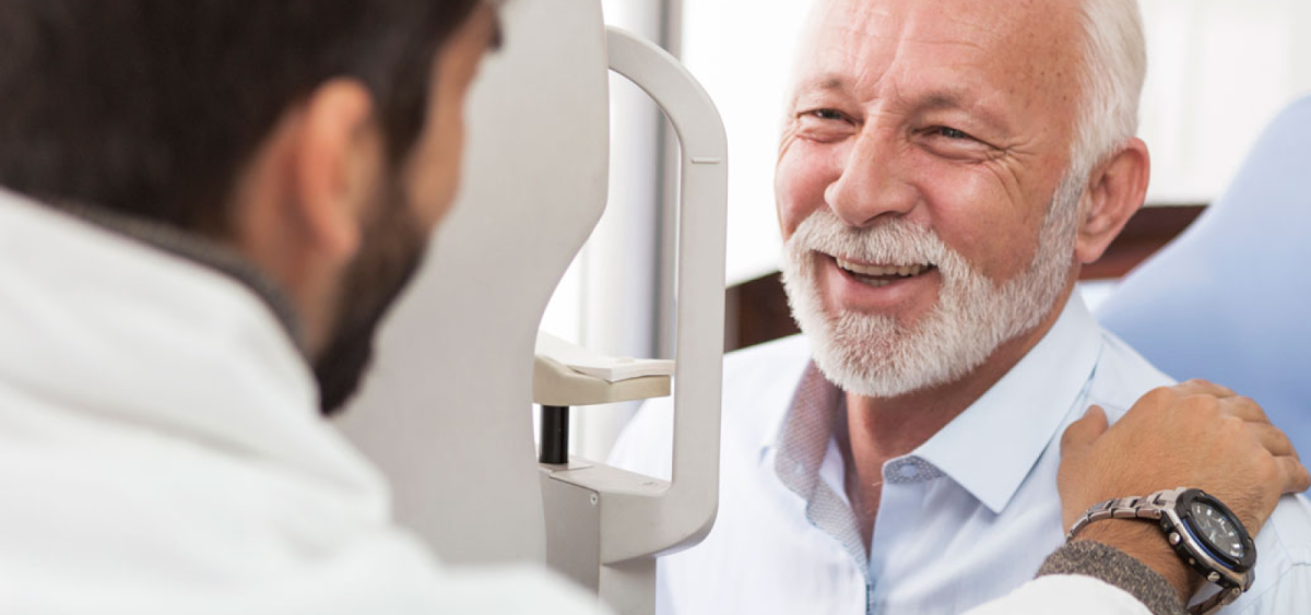 Paul Delatore, smiling at another person