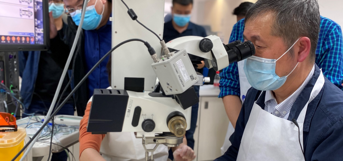Eye care professionals receiving hands-on surgical training
