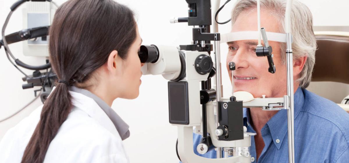 Man getting eyes examined by eye doctor