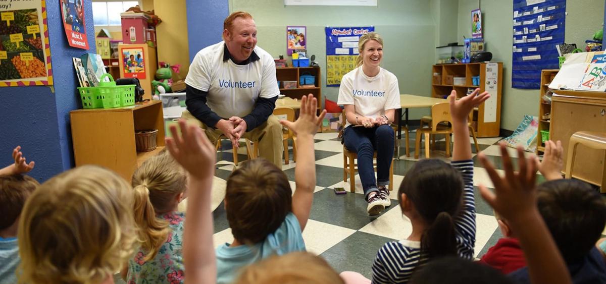 Alcon Volunteers in a classroom