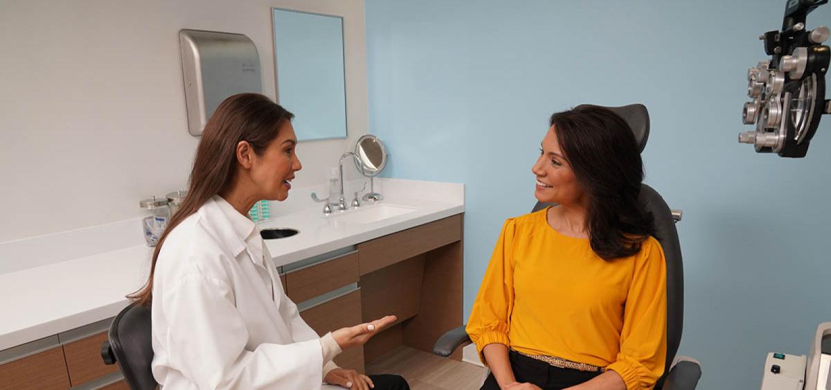 Eye care professional speaking with patient