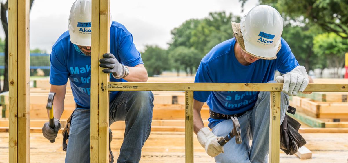 Alcon volunteers building a home