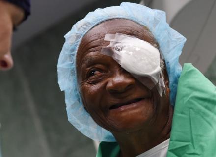 Older female patient with bandage over on eye