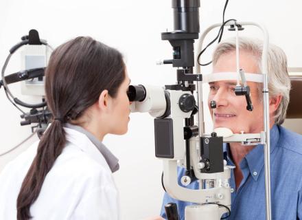 Man getting eyes examined by eye doctor