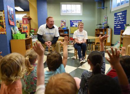 Alcon Volunteers in a classroom